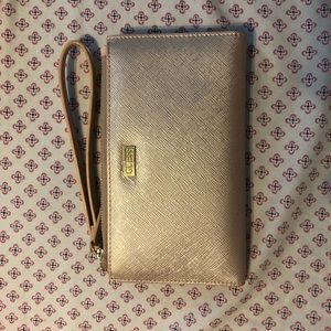 Metallic pink GUESS wristlet.